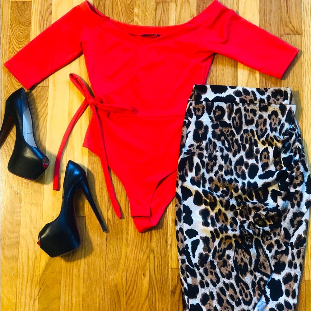 Red hang off the shoulder body suit